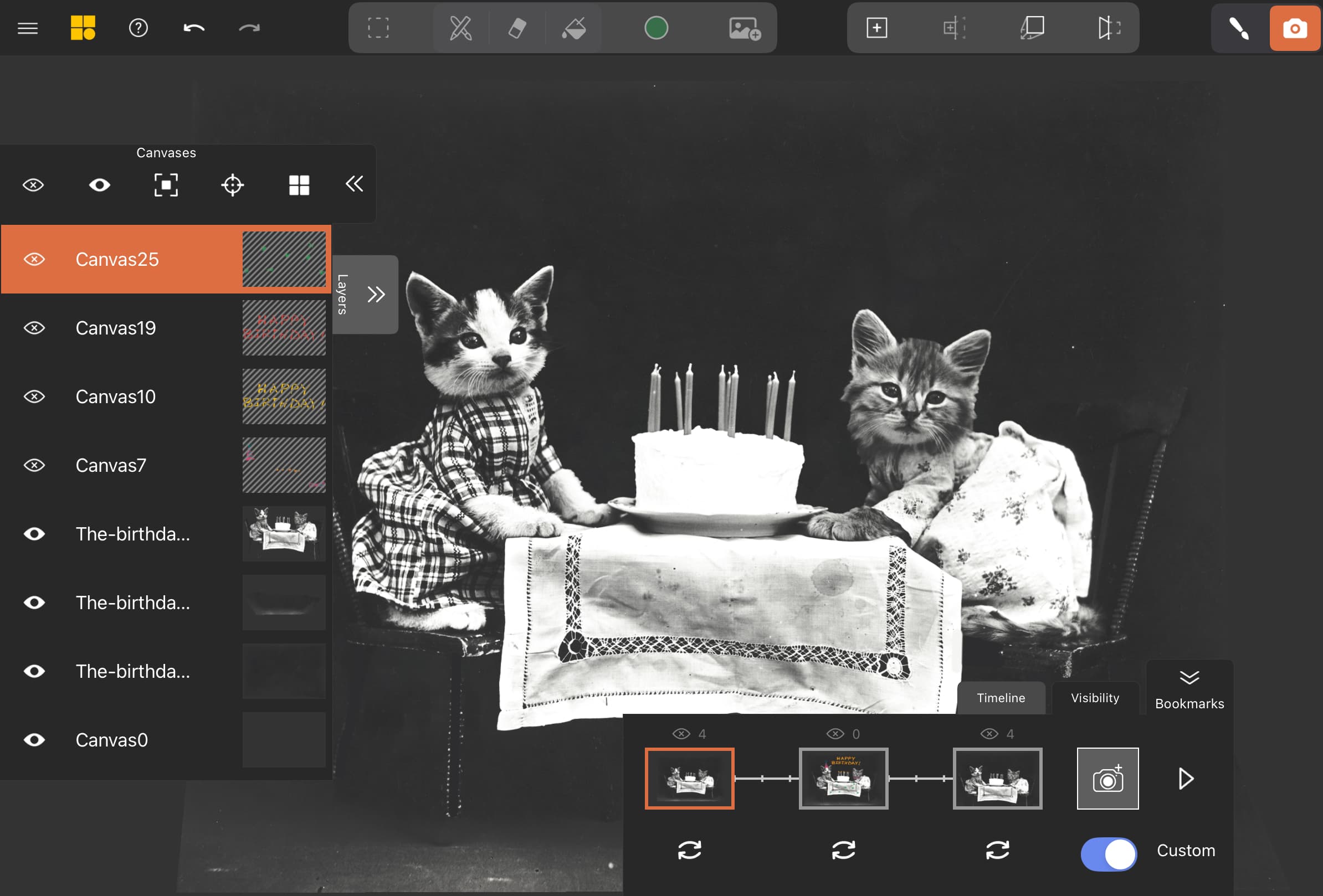 A photograph of cats with a cake