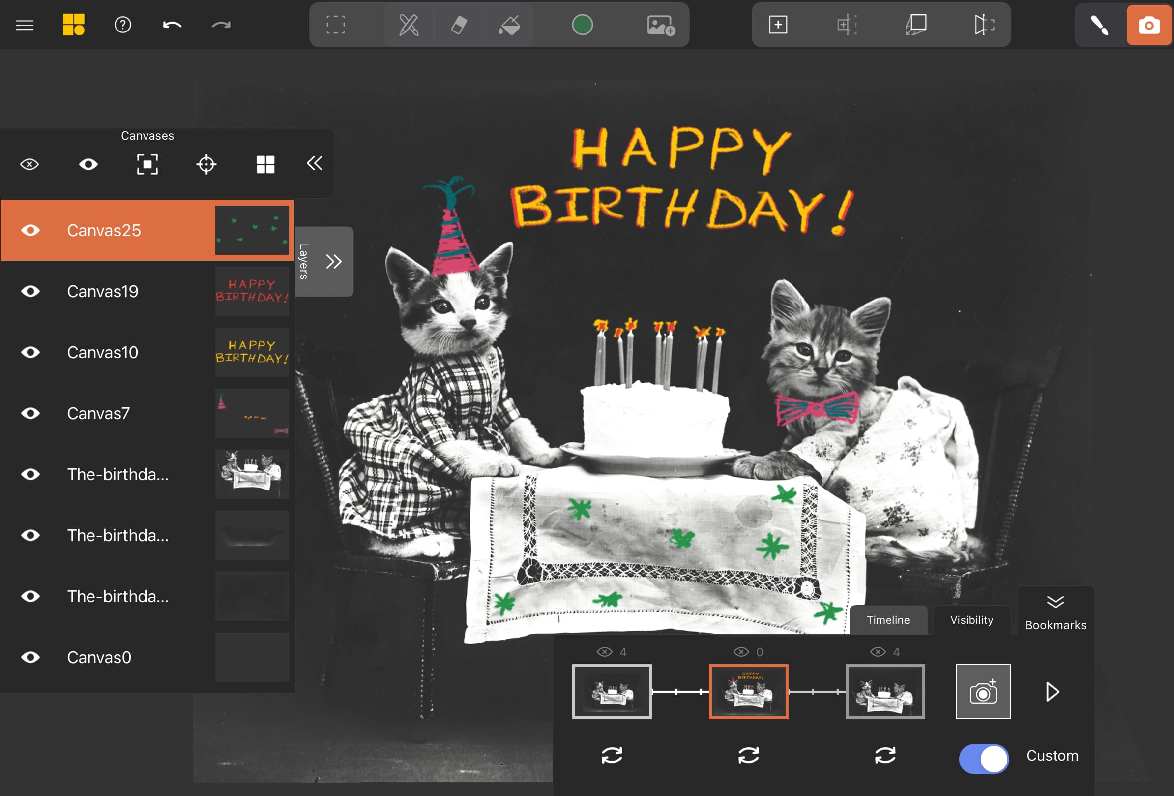 A photograph of cats with a cake with an annotated greeting